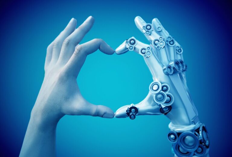 A human hand creating a heart with a robotic hand.
